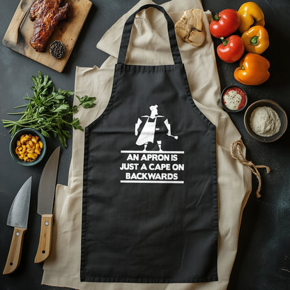 Apron Cape: The Grill Master’s Secret! Funny T-shirt for BBQ Heroes, Unisex Design - Because Every Chef Needs Superpowers!